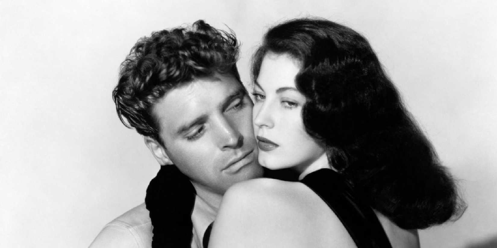Black and white shot of Ava Gardner holding Burt Lancaster in The Killers