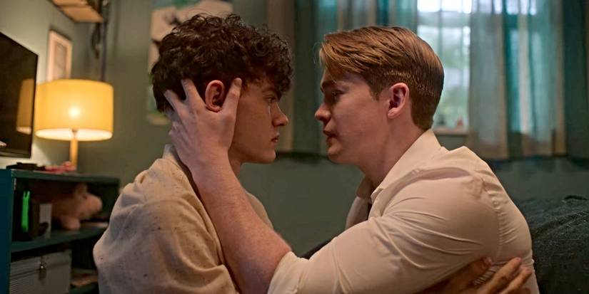 Nick holds Charlie's face and looks into his eyes in Season 2 of Heartstopper.