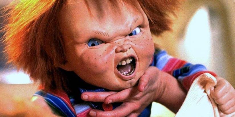 Chucky screams while attacking a human in Child's Play.