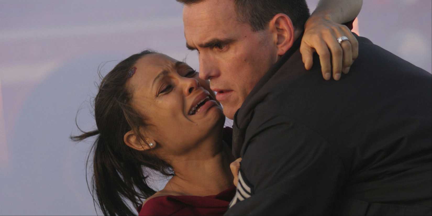 John Ryan holding a crying Christine Thayer in 'Crash'