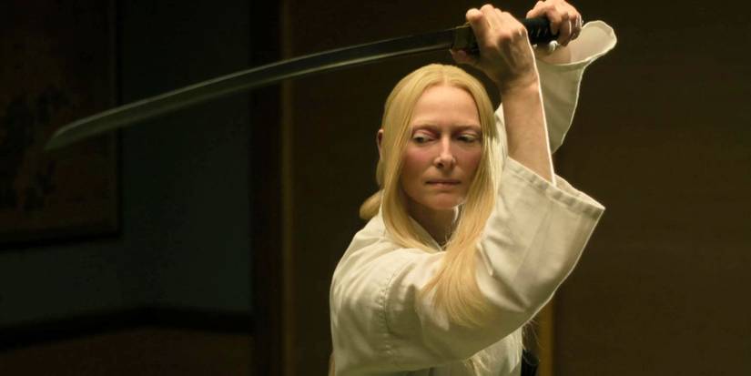Tilda Swinton wielding a katana above her head in The Dead Don't Die