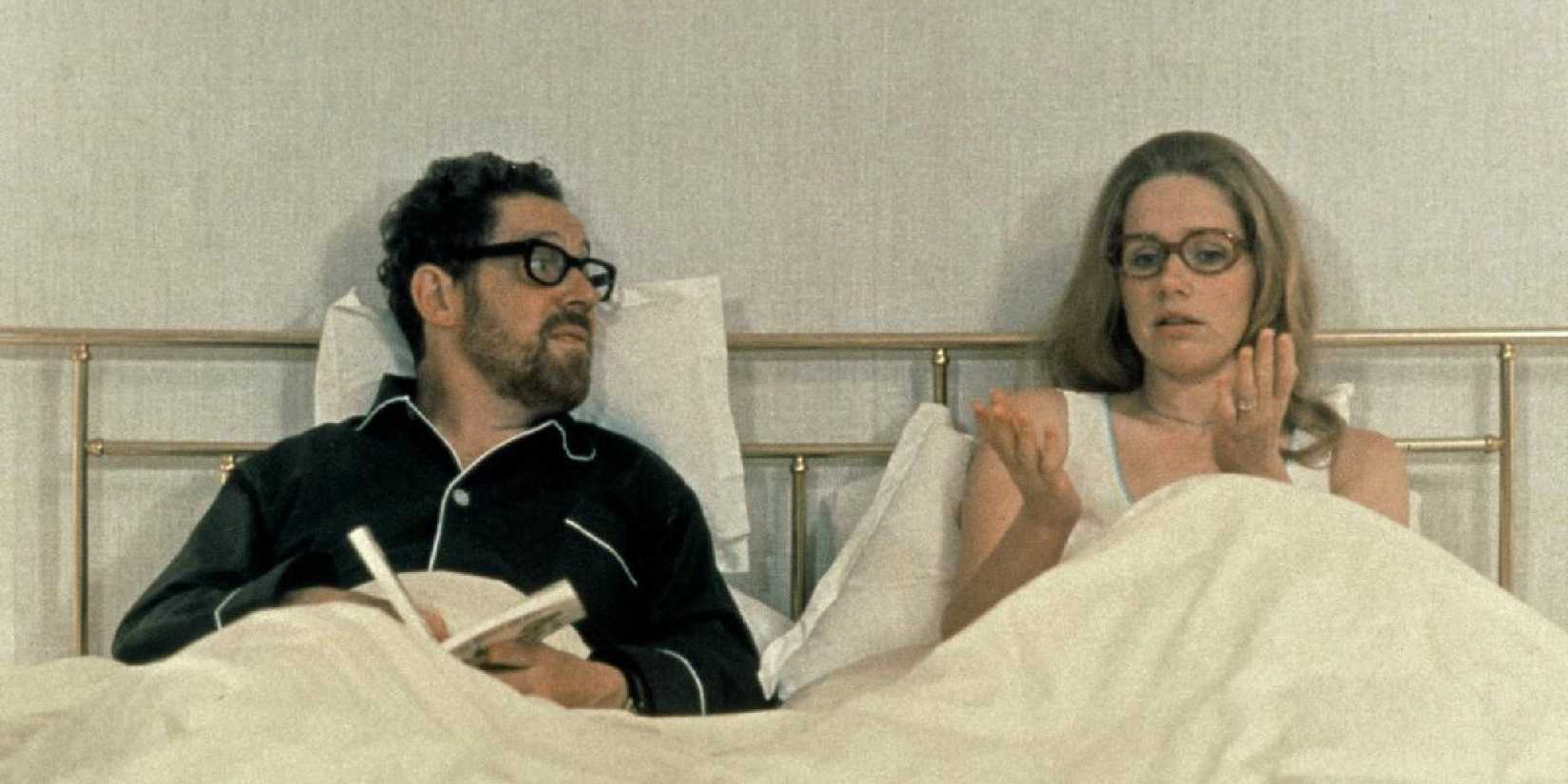 Erland Josephson and Liv Ullmann side by side in bed having a conversation in Scenes From a Marriage.