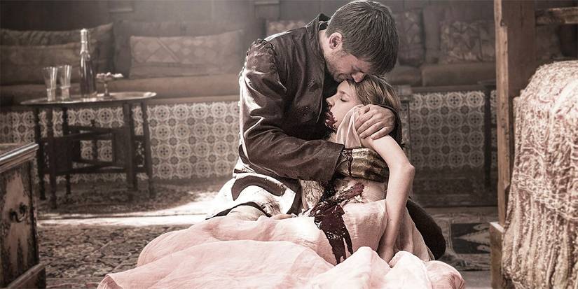 Jaime Lannister holding his daughter Myrcella after she's been poisoned to death in Game of Thrones