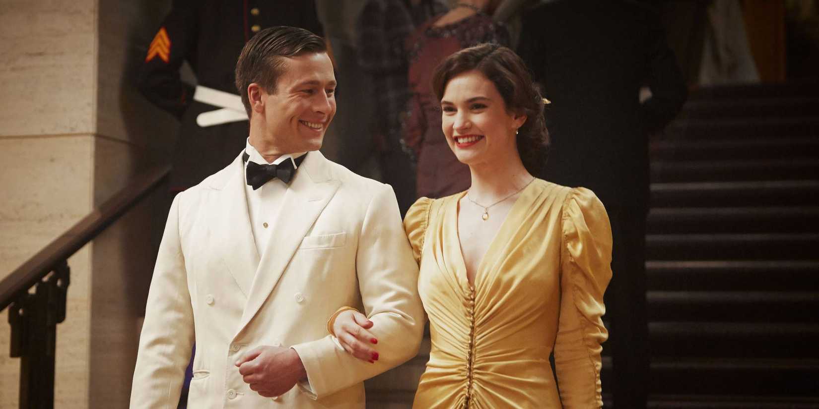 Glen Powell and Lily James walking down stairs together in The Guernsey Literary and Potato Peel Society.