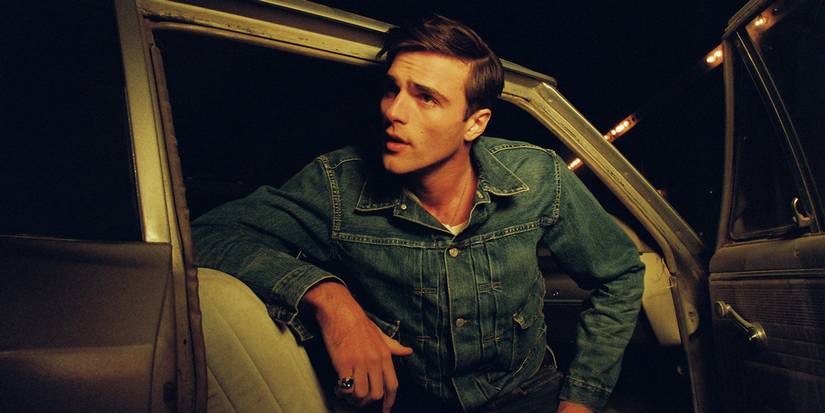 Jacob Elordi as Bobby getting out of a car in He Went That Way.