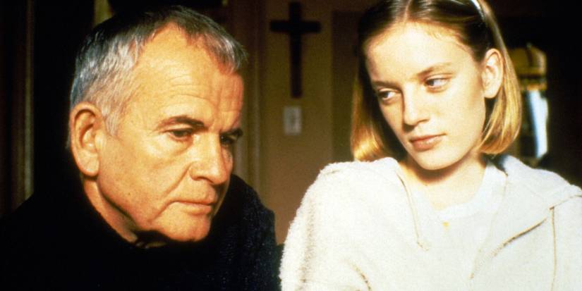 Nicole looking at a pensive Mitchell in The Sweet Hereafter