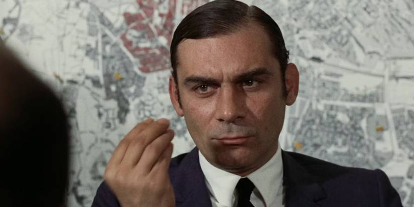 The Police Inspector with a serious expression looking at someone Investigation of a Citizen Above Suspicion