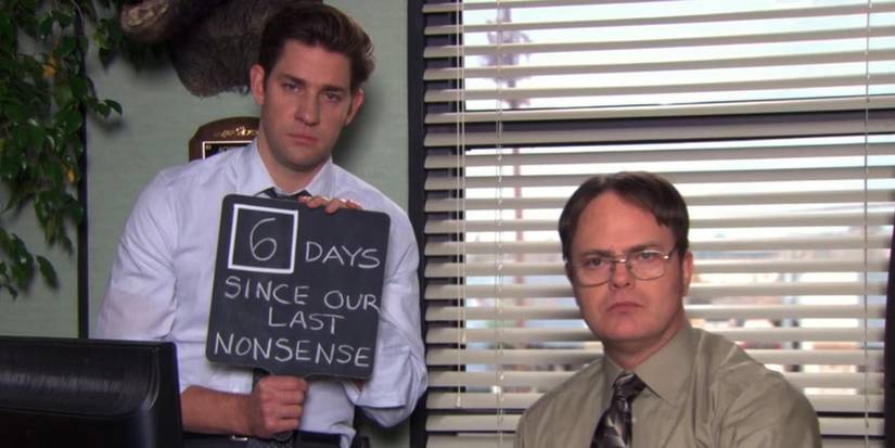 John Krasinski as Jim and Rainn Wilson as Dwight holding a '"6 Days Since Our Last Nonsense" sign in The Office