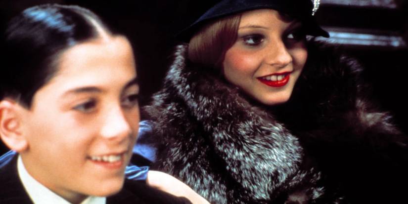 Jodie Foster and John Cassini grinning in Bugsy Malone