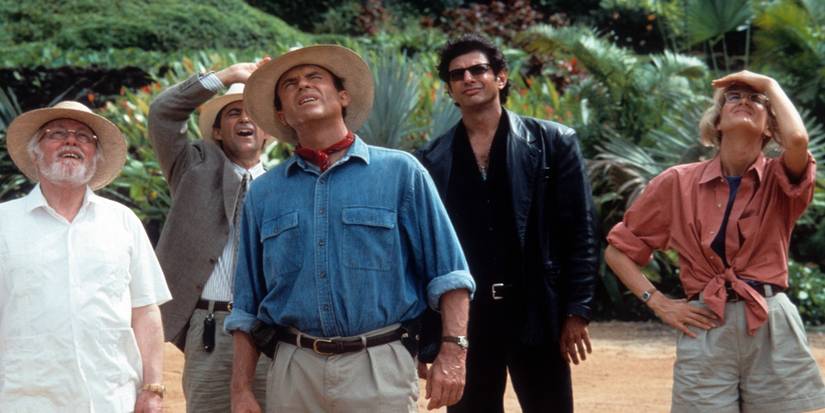 Richard Attenborough, Jeff Goldblum, Sam Neill, Laura Dern, and Martin Ferrero looking up in 'Jurassic Park'