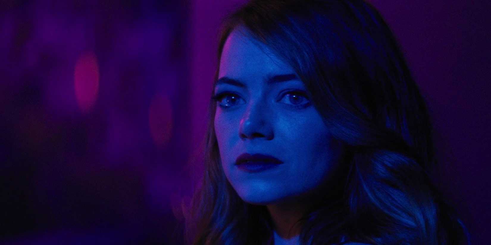 Mia looking intently at someone in La La Land