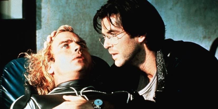Angelo (Pierce Brosnan) appearing to comfort Jobe (Jeff Fahey) in The Lawnmower Man