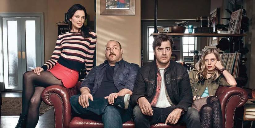 Loudermilk Cast sitting on a couch