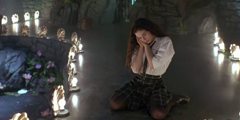 Christina dancing on stage dressed as a school girl in Exotica