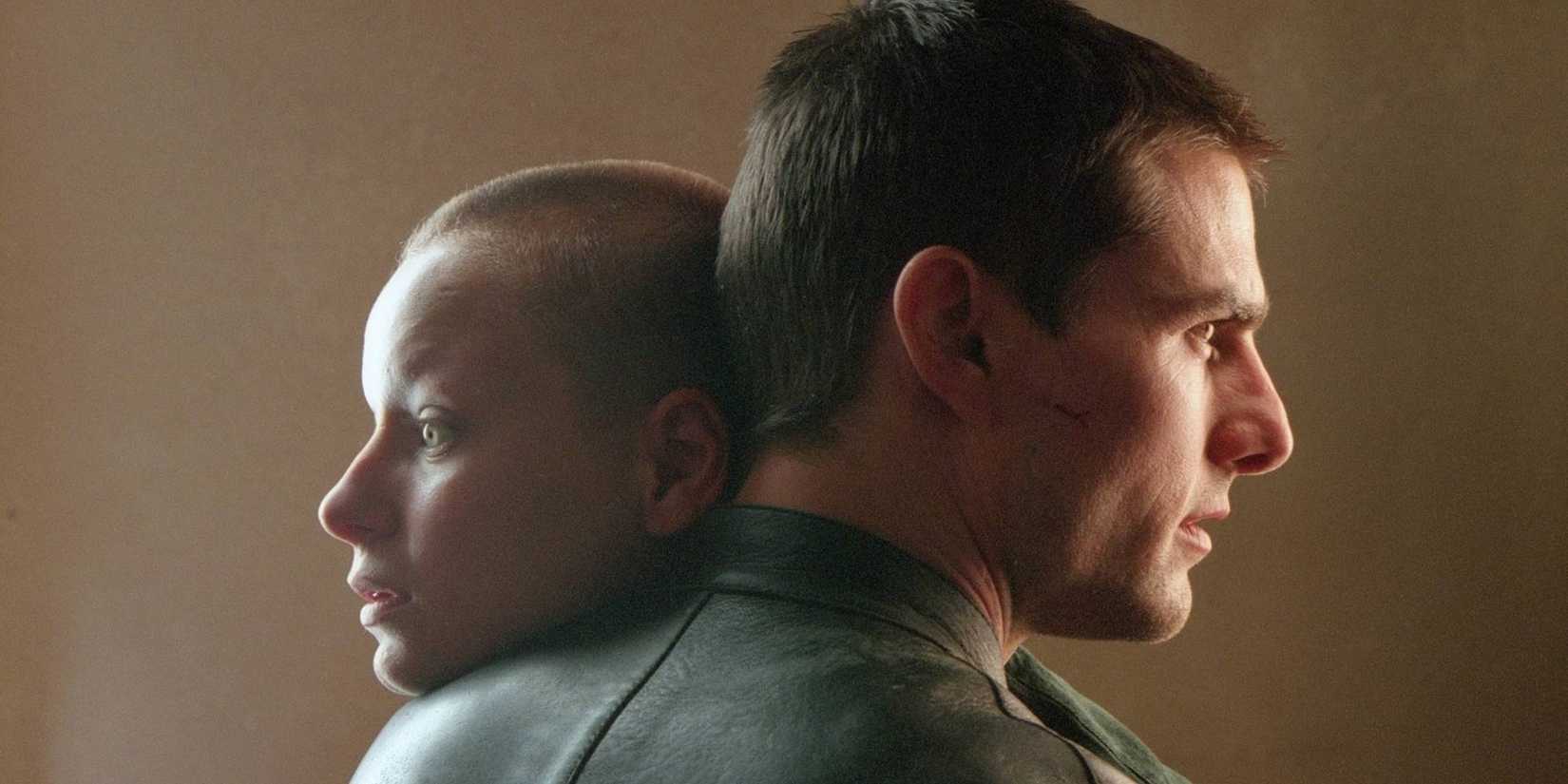 Tom Cruise and Samantha Morton hugging with serious expressions in Minority Report.