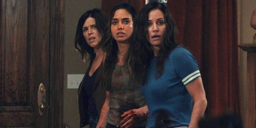 Neve Campbell, Melissa Barrera, & Courteney Cox, bloodied & bruised, look off screen in Scream 5