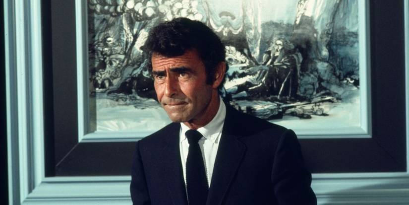 Rod Serling standing in front of a painting in Night Gallery