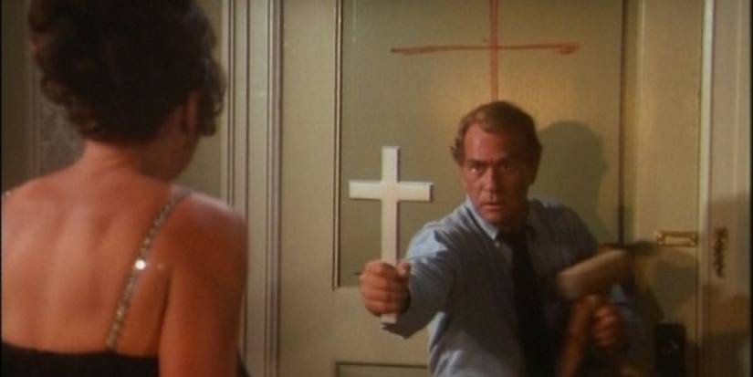 Darren McGavin fending off a vampire with a cross on Kolchak: The Night Stalker. 