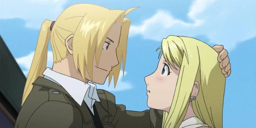Older Edward Elric romantically holding Winry in Fullmetal Alchemist: Brotherhood