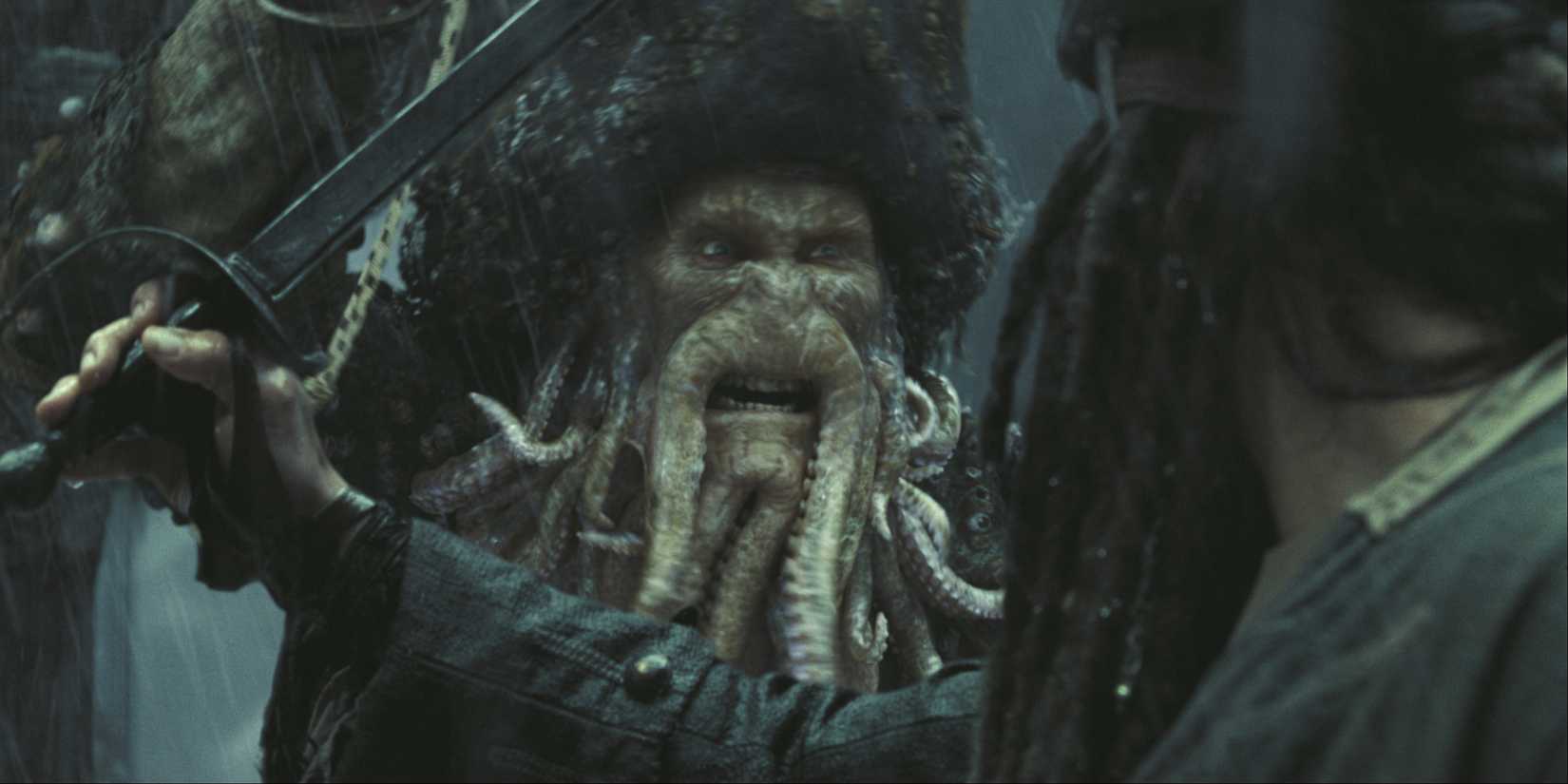 Bill Nighy as Davy Jones sword fights with Johnny Depp as Jack Sparrow in Pirates of the Caribbean: At World's End