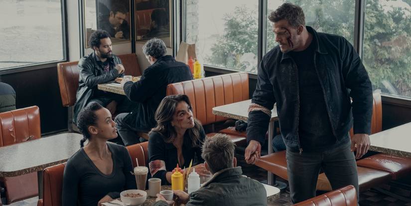 Reacher, Neagley, Dixon, and O'Donnell sitting in a diner in the Reacher Season 2 finale.