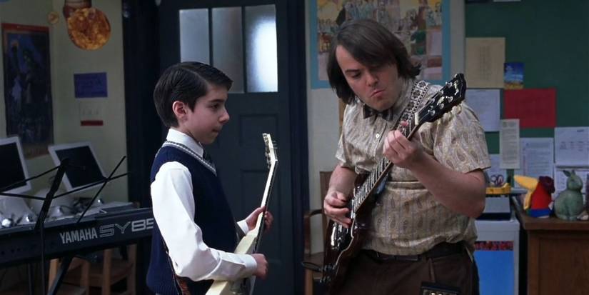 Dewey (right) teaches Zack (left) to play the guitar