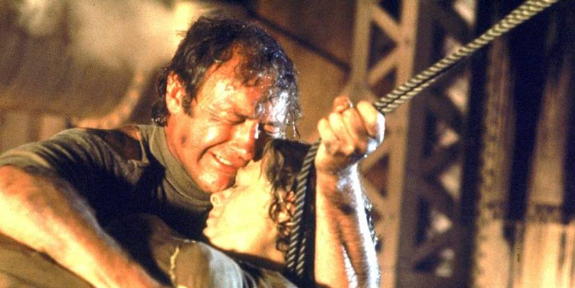 Reverend Scott (Gene Hackman) mourns Belle (Shelley Winters) in 'The Poseidon Adventure'