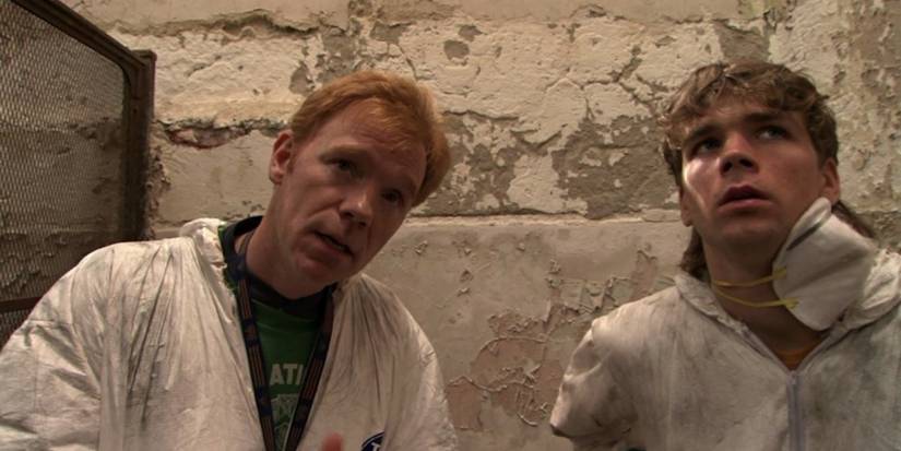 Phil and Jeff sitting on the floor and looking up with confused expressions in Session 9.