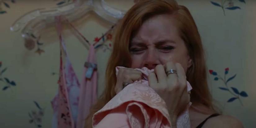Amy Adams in Sharp Objects.crying into a towel.