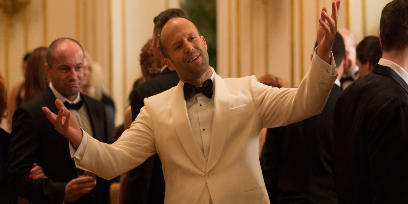 Jason Statham as Rick Ford spreading his arms to welcome someone in Spy