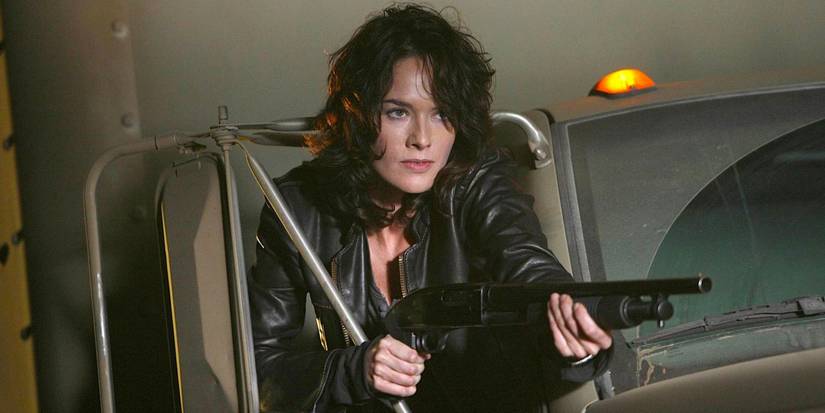 Sarah Connor (Lena Headey) leans out of a truck window holding a shotgun on 'Terminator: The Sarah Connor Chronicles'