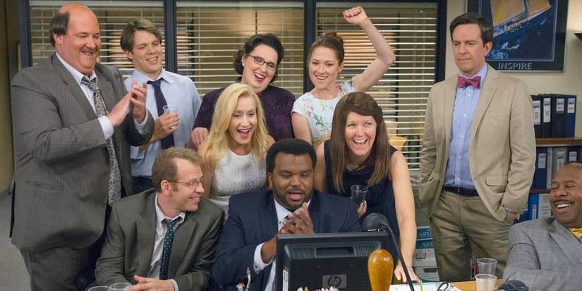 The cast of US series The Office gather around Darryl's computer and cheer in the series finale.