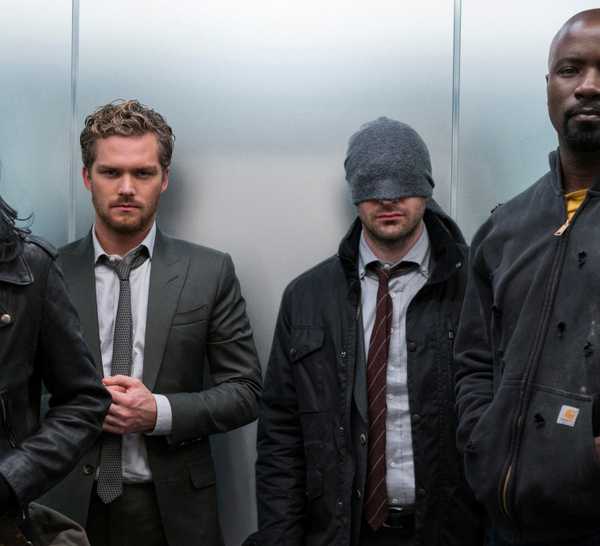 Jessica Jones, Danny Rand, Matt Muedock, and Luke Cage in an elevator in The Defenders.