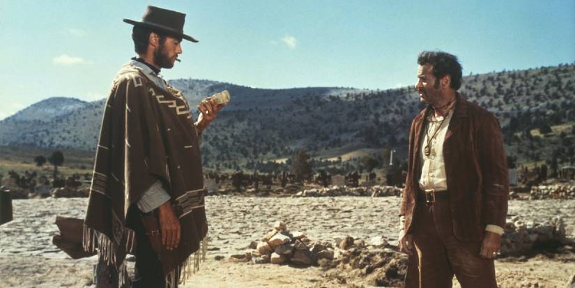 The Man with No Name and another man talking in The Good, the Bad and the Ugly