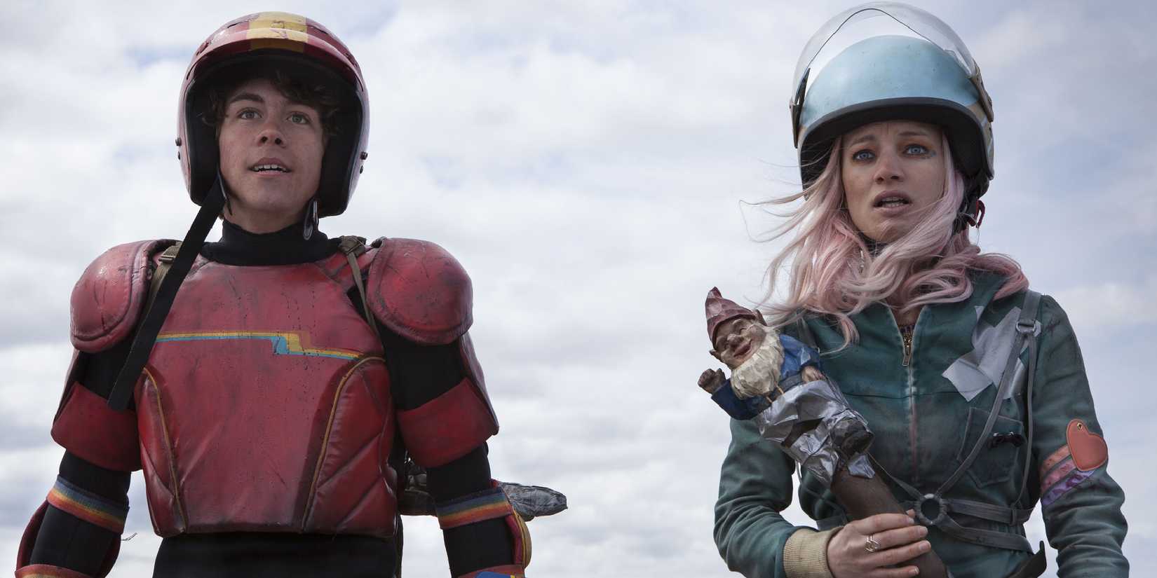 Two teens in suits looking to the distance in Turbo Kid - 2015