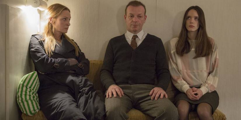 Mrs. H, H, and Joe sitting next to each other and looking awkward in the film Nymphomaniac