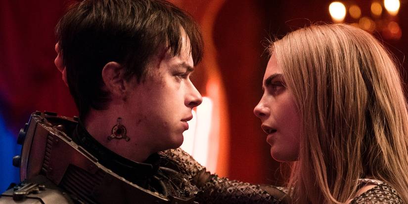 Dane DeHaan and Cara Delevingne as Valerian and Laureline looking at one another in Valerian and the City of a Thousand Planets