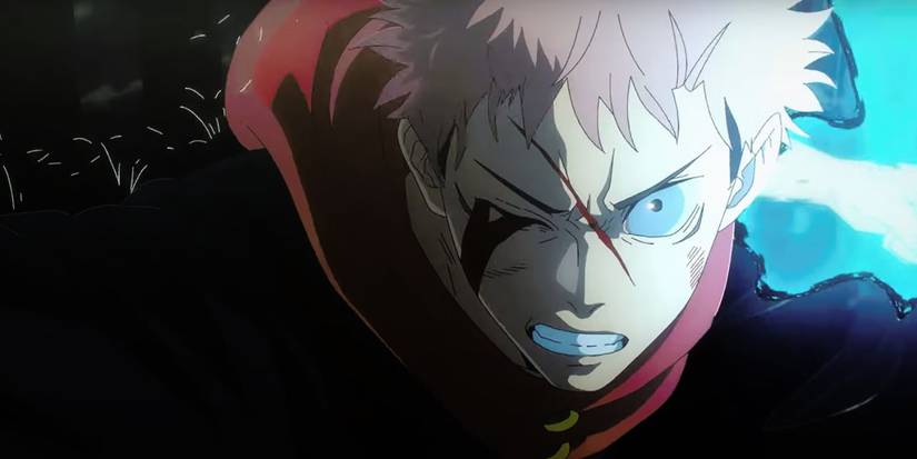 Yuji charging cursed energy in his fist with a damaged face in Jujutsu Kaisen
