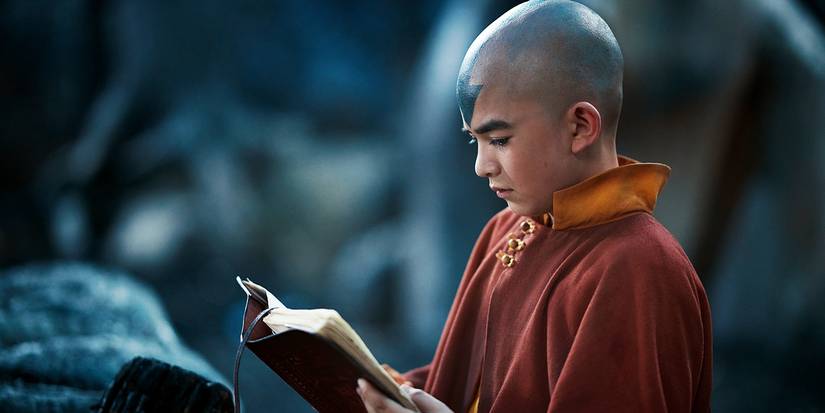 Gordon Cormier as Aang reading a book in Avatar the Last Airbender