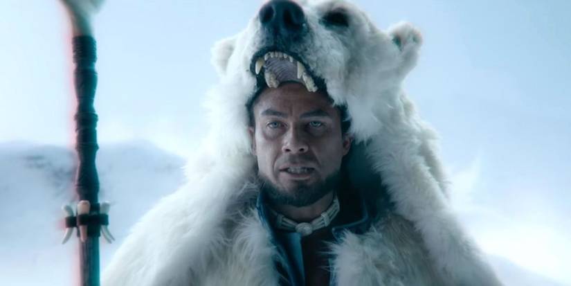 Avatar Kuruk wearing a bear fur and standing in a snowy field in Netflix's Avatar The Last Airbender.