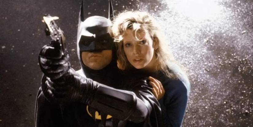 Vicky Vale holding on to Batman as they're about to swing in Batman.