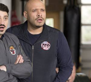 Two firefighters looking shocked