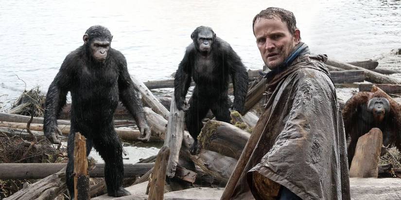 Andy Serkis, Toby Kebbell & Jason Clarke stand near a lake in Dawn of the Planet of the Apes
