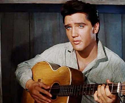 Elvis Presley as Pacer Burton playing guitar in 'Flaming Star'