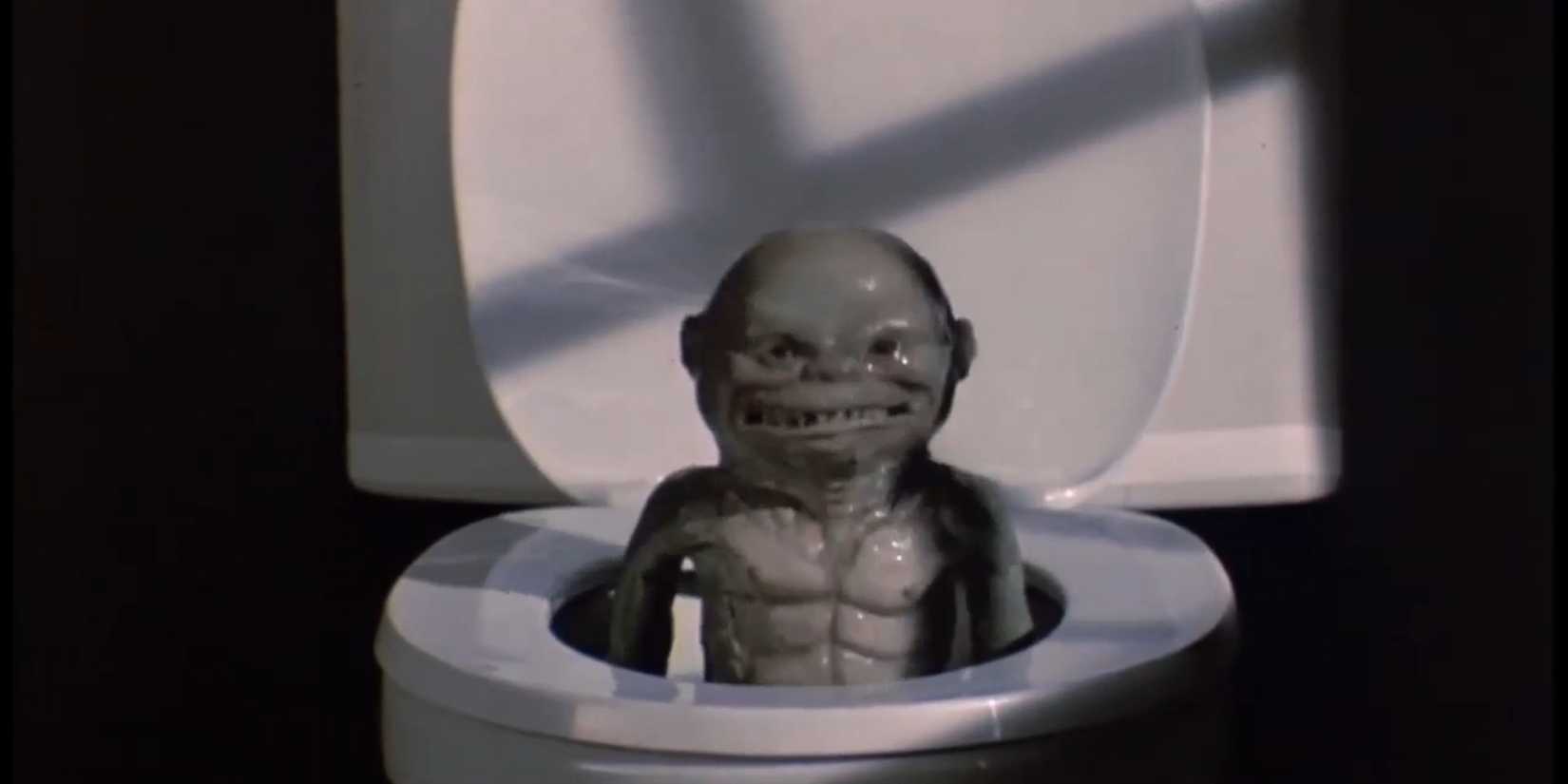 A monster comes out of the toilet in 'Ghoulies'