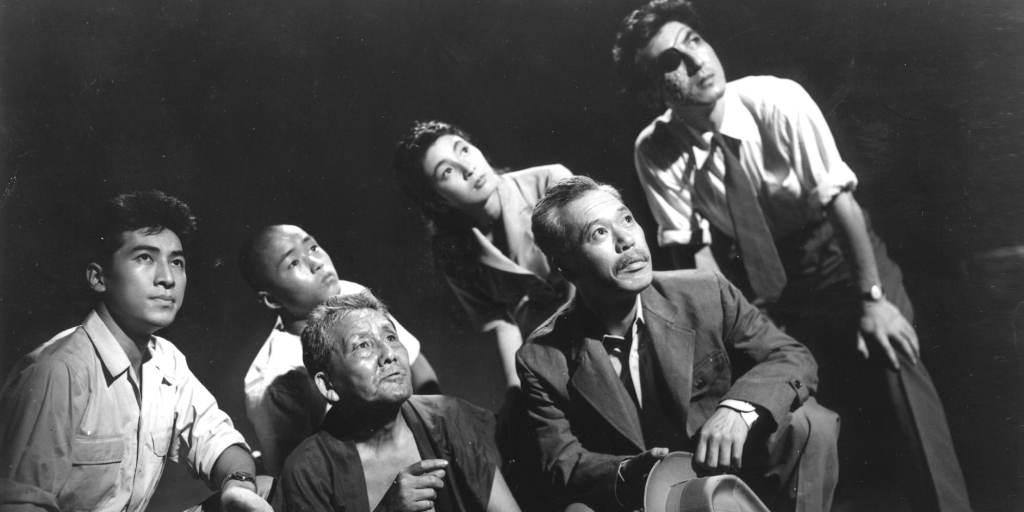 A group of Japanese people looking up in Godzilla - 1954