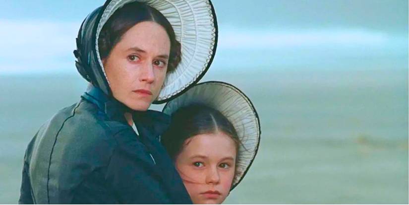 Holly Hunter and Anna Paquin wait on the shores of New Zealand in The Piano.