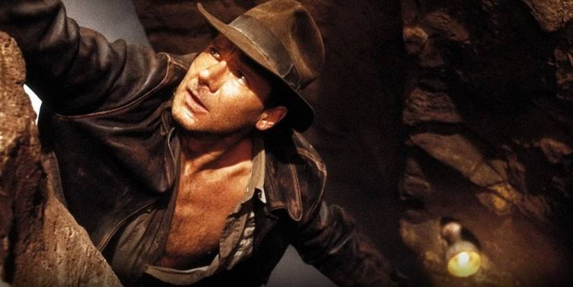Indiana Jones est suspendue à une falaise, le Saint Graal est en arrière-plan