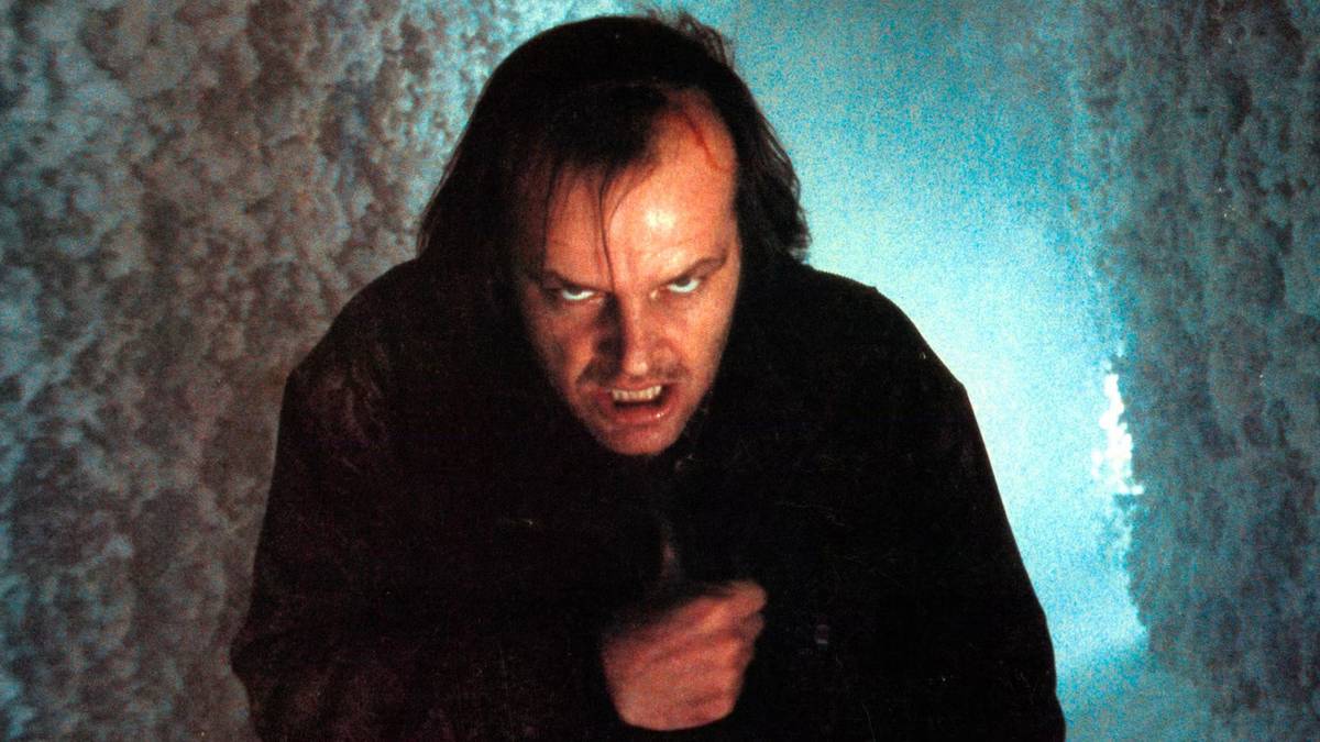 Jack Torrance standing outside in the cold and staring menacingly into the camera in The Shining