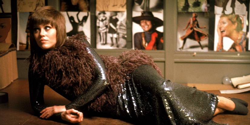 Jane Fonda as Bree Daniels, wearing a sequin dress and lying on a bed in Klute